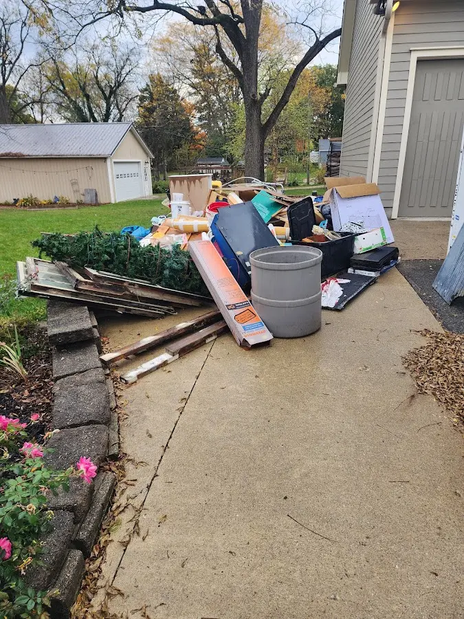 Dumpster being loaded with debris for Residential Dumpster Rental in Ripley
